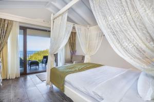 A bed or beds in a room at Alya Villa Butik Hotel