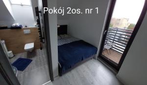 Postel nebo postele na pokoji v ubytování Kaper Rewa