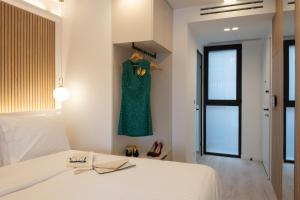 Postel nebo postele na pokoji v ubytování Incanto Boutique Suites - Mets