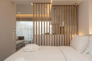 Postel nebo postele na pokoji v ubytování Incanto Boutique Suites - Mets
