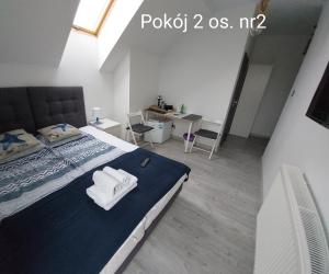 Postel nebo postele na pokoji v ubytování Kaper Rewa