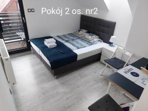 Postel nebo postele na pokoji v ubytování Kaper Rewa