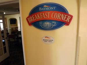 a breakfast corner sign on the wall of a restaurant at Baymont by Wyndham Greensboro/Coliseum in Greensboro
