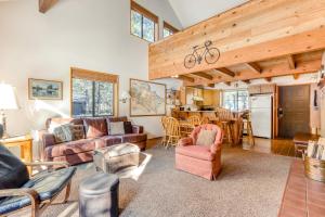 a living room with couches and chairs and a kitchen at 7 Hare Lane in Sunriver