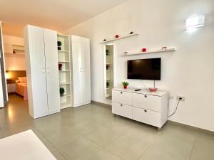 TV a/nebo společenská místnost v ubytování Apartamento Rest&Pool