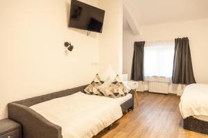 Rúm í herbergi á Hotel Soers