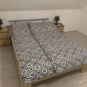 Postel nebo postele na pokoji v ubytování Tilador Vendégház