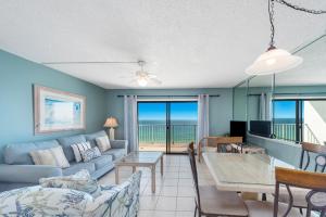 a living room with a couch and a table at Summit Beach Resort 1412 in Panama City Beach