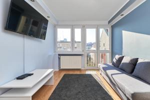 Televízia a/alebo spoločenská miestnosť v ubytovaní Family Apartment Szewska Market Square by Noclegi Renters