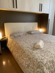 Posteľ alebo postele v izbe v ubytovaní PIRANDELLO HOME