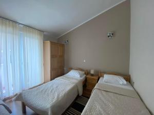 Postel nebo postele na pokoji v ubytování Casa Liburnia