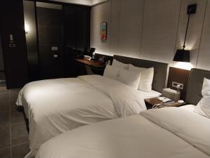 Postel nebo postele na pokoji v ubytování Brown Dot Hotel Busan Station