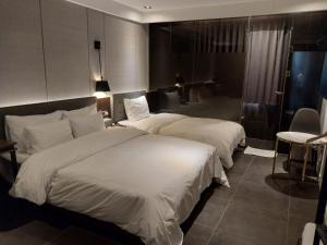 Postel nebo postele na pokoji v ubytování Brown Dot Hotel Busan Station