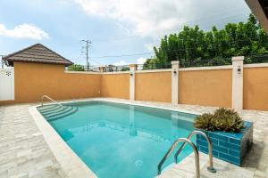 a swimming pool in a house at Brand New Pool Manor Park with WIFI centrally-located in Kingston
