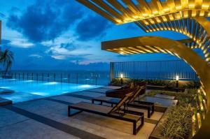 a view of a swimming pool at night at Căn hộ The Sóng An Gia - Vũng Tàu Apartment in Vung Tau