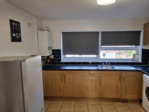 a kitchen with a sink and a window at Haven 1 in Thamesmead