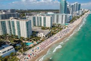 an aerial view of a beach and buildings at Amazing Apartment on hollywood beach TIDES in Hollywood