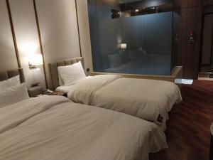 Postel nebo postele na pokoji v ubytování Brown Dot Hotel Busan Station