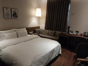 Postel nebo postele na pokoji v ubytování Brown Dot Hotel Busan Station