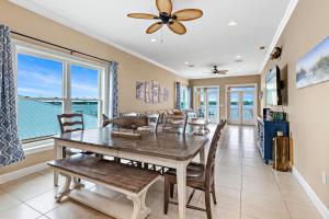 a dining room with a table and chairs at Eagle's Nest in Gulf Shores