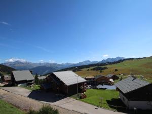 an aerial view of a village with mountains in the background at Les Saisies - Studio Cabine Équipé pour 4 avec Balcon - FR-1-293-150 in Les Saisies