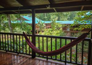 a hammock on the balcony of a resort at Selva Verde Lodge in Sarapiquí