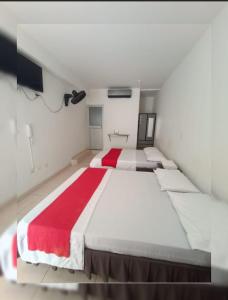 Postel nebo postele na pokoji v ubytování Hotel Gueicer Cucuta