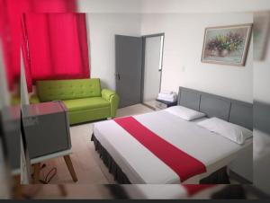 Postel nebo postele na pokoji v ubytování Hotel Gueicer Cucuta