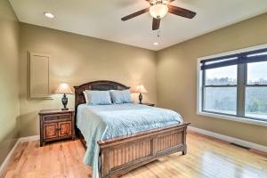 a bedroom with a bed and a ceiling fan at Cozy Home with Patio, 2 Mi to Dale Hollow Lake! in Frogue