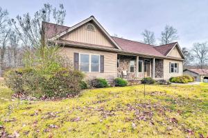 a house with a large yard in front of it at Cozy Home with Patio, 2 Mi to Dale Hollow Lake! in Frogue