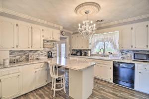 a kitchen with white cabinets and a large island at Bristol Retreat with Creek Access 2 Mi to Dtwn in Bristol