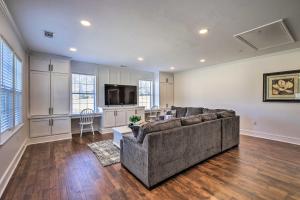 a large living room with a couch and a kitchen at Charming Newnan Getaway about Mins to Downtown! in Newnan