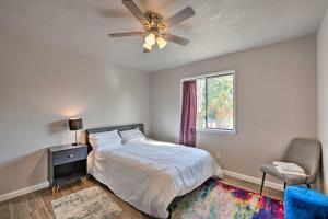 a bedroom with a bed with a ceiling fan and a window at Pet-Friendly Sacramento Home Less Than 5 Mi to Dtwn! in Sacramento