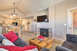 a living room with a couch and a fireplace at Spacious Fraser Condo about 6 Mi to Winter Park! in Fraser