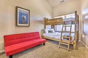 a bedroom with a bunk bed and a red bench at Spacious Fraser Condo about 6 Mi to Winter Park! in Fraser