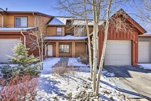 a house with a garage in the snow at Spacious Fraser Condo about 6 Mi to Winter Park! in Fraser