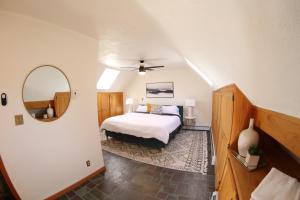 a bedroom with a bed and a mirror at Rebel Ranch Medicine Bow National Forest in Laramie