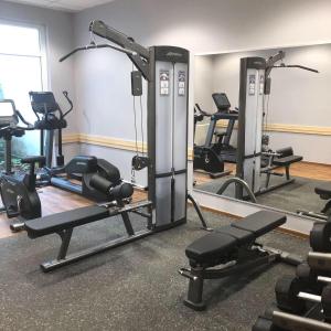 a gym with several tread machines in a room at Holiday Inn Express Frankfurt Messe, an IHG Hotel in Frankfurt