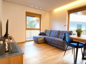 Lux Apartment Ski&Golf tesisinde bir oturma alanı