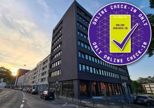 a building with a sign in front of it at KONCEPT HOTEL International in Cologne