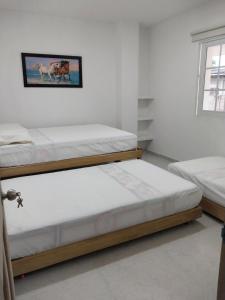 Säng eller sängar i ett rum på Cabañas Berakah