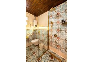 a bathroom with a toilet and a shower at Marrakesh 1BDR w Jacuzzi Terrace Downtown Cairo in Cairo +16 photos