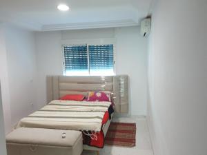 Кровать или кровати в номере Bright two bedroom apartment Lac2 Tunis Tunisia