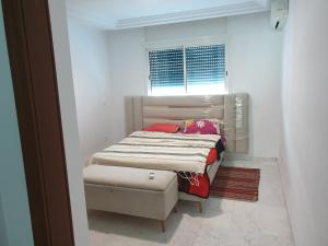 a small bedroom with a bed and a window at Bright two bedroom apartment Lac2 Tunis Tunisia in Tunis