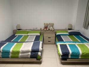 Voodi või voodid majutusasutuse Daiwen Homestay toas