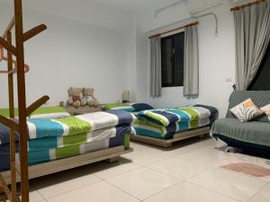 Voodi või voodid majutusasutuse Daiwen Homestay toas