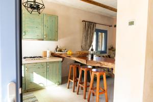 A kitchen or kitchenette at Chaihoutes stone villa into Olive farm in Zia