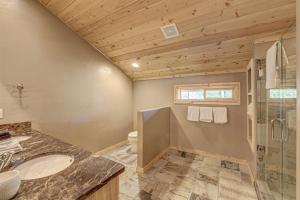 a bathroom with a shower toilet and a sink at Pinehurst Retreat in Brian Head +48 photos