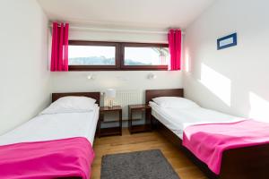 Posteľ alebo postele v izbe v ubytovaní Hotel Beskid