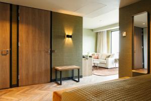 Een bed of bedden in een kamer bij Van der Valk Hotel Apeldoorn - de Cantharel